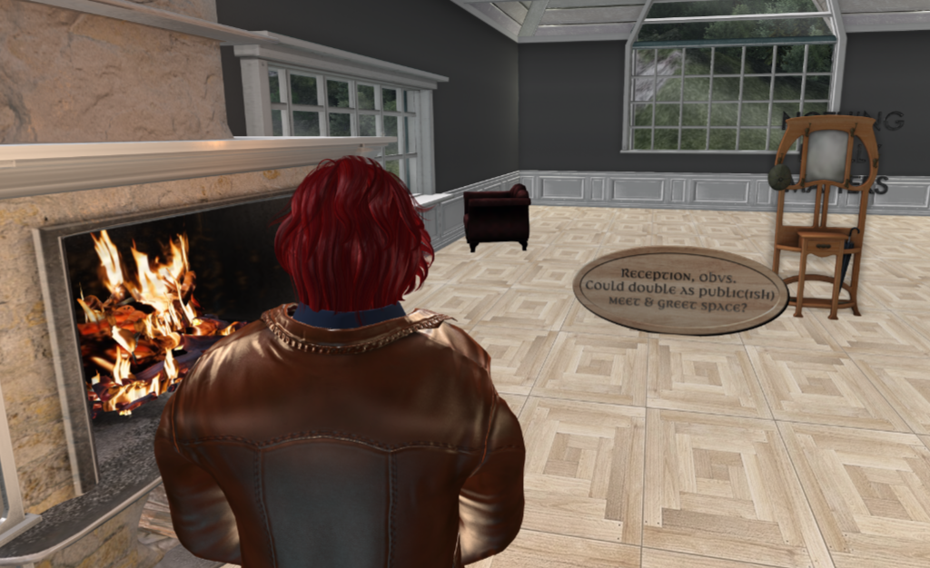 Nathaniel, standing by a fireplace, looking at a wooden sign suggesting that this room be the main reception room for the public aspect of the house.